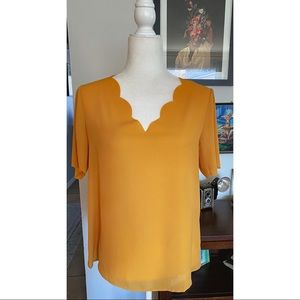 Yellow/mustard top, v neck, scallop detail